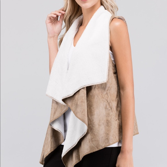 Jackets & Blazers - Faux leather/fur vest.